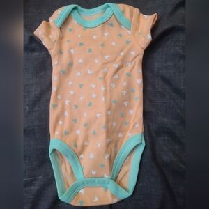 Orange onsie with heart designs 0-3 months